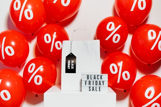 Vibrant Black Friday sale display with red balloons and a shopping bag showcasing discounts.